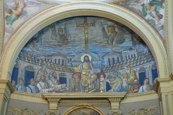 The Mosaic in the apse of the 4th century church of Santa Pudenziana at Rome, showing on the right below the winged bull the octagonal Byzantine church to the left (This is the first version of the church of Hagia-Sion), and the square house to the right (Photo: Welleschik - Opera propria / Through Wikipedia).