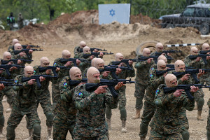 Pro-Iranian Hezbollah fighters take part in a staged military exercise in a camp in the Lebanese southern village of Aramta. The show came ahead of the 23rd "Liberation Day", the annual celebration of the withdrawal of Israeli forces from south Lebanon on May 25, 2000. (Marwan Naamani/dpa via Reuters Connect)