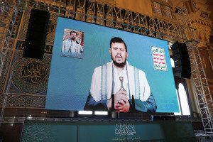 Houthi leader Abdul-Malik al-Houthi addresses followers via a video link at the al-Shaab Mosque, formerly al-Saleh Mosque, in Sanaa, Yemen February 6, 2024. REUTERS/Khaled Abdullah