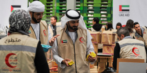 Volunteers from Emirates Red Crescent prepare parcels with humanitarian aid for Gaza to be transferred through the Rafah border crossing between Egypt and the Gaza Strip, in Cairo, Egypt, March 30, 2024. Photo: Reuters Connect by Shokry Hussien