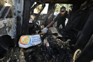 Palestinians inspect the heavily damaged vehicles after the attacks target officials working at the US-based international volunteer aid organization World Central Kitchen WCK, in Dair El-Balah, Gaza Strip, on April 02, 2024 (Photo: Omar Ashtawy apaimages/via REUTERS).