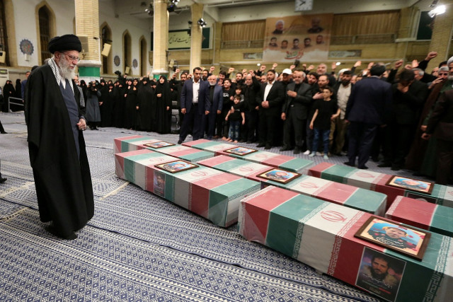 Iran's Supreme Leader, Ayatollah Ali Khamenei looks at the coffins of members of the Islamic Revolutionary Guard Corps who were killed in Damascus, during a funeral ceremony in Tehran, Iran April 4, 2024 (Photo: Office of the Iranian Supreme Leader/WANA (West Asia News Agency)/Handout via REUTERS).