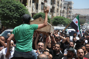 Syrians mourn dead people whose families said they were shot by the Turkish side in the city of Afrin in Aleppo Governorate.
(Photo: Arab World Press via Reuters, July 2, 2024)