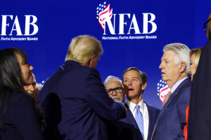 U.S. President Donald Trump speaks with Faith & Freedom Coalition founder Ralph Reed at the National Faith Advisory Summit in Powder Springs, Georgia, on October 28, 2024. REUTERS/Brendan McDermid.