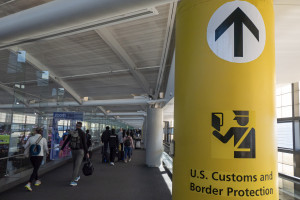 U.S. Customs and Border Protection CBP sign, inscription and symbol in yellow background in Newark Liberty International Airport EWR serving the New York Metropolitan area with arriving passenger walking in the terminal towards the immigration passport control. November 3, 2024 Photo: Nicolas Economou via Reuters Connect)