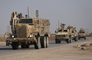 U.S. military vehicles drive in Hasaka, Syria December 6, 2024. REUTERS/Orhan Qereman