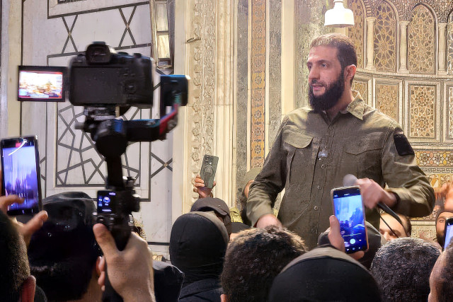HTS (Hayaat Tahrir Al Sham) leader Ahmed Al-Shara, also known as Abu Muhammad Al-Jolani, commander in the operations department of the Syrian armed opposition, delivers a speech from inside the Umayyad Mosque after his troops declared their entry into the capital and the overthrow of Bashar Al-Assad, in Damascus, Syria, on December 8, 2024. Photo by Balkis Press/ABACAPRESS.COM