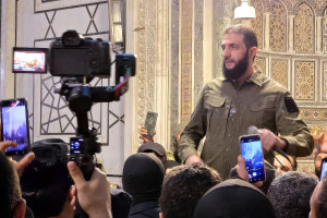HTS (Hayaat Tahrir Al Sham) leader Ahmed Al-Shara, also known as Abu Muhammad Al-Jolani, commander in the operations department of the Syrian armed opposition, delivers a speech from inside the Umayyad Mosque after his troops declared their entry into the capital and the overthrow of Bashar Al-Assad, in Damascus, Syria, on December 8, 2024. Photo by Balkis Press/ABACAPRESS.COM