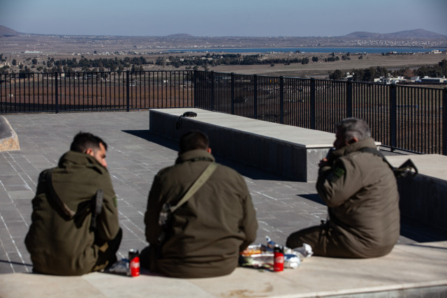Israeli soldiers at a lookout point next to the boundary fence delineating the UN-patrolled buffer zone between Israel and Syria in the Golan Heights, on December 15, 2024. (Photo by Mati Milstein/NurPhoto)
