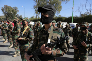 Houthi fighters take part in a parade for people who attended Houthi military training as part of a mobilization campaign, in Sanaa, Yemen December 18, 2024. REUTERS/Khaled Abdullah