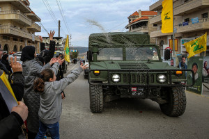 Lebanese supporters of pro-Iranian Hezbollah throw rice at a Lebanese army jeep as it drives by in the southern Lebanese town of Bint Jbeil.
January 26, 2025, Photo by Marwan Naamani/dpa via Reuters Connect