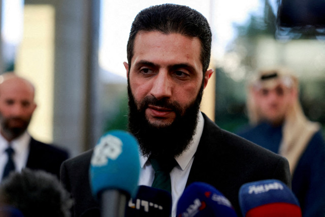 FILE PHOTO: FILE PHOTO: Syria's de facto leader Ahmed al-Sharaa, also known as Abu Mohammed al-Golani, speaks to the media during a meeting with Qatar's Minister of State Mohammed bin Abdulaziz Al-Khulaifi, after the ousting of Syria's Bashar al-Assad, in Damascus, Syria, December 23, 2024. REUTERS/Ammar Awad/File Photo/File Photo