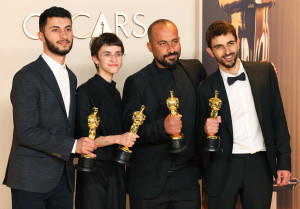 Basel Adra, Rachel Szor, Hamdan Ballal and Yuval Abraham pose with the Oscar for Best Documentary Feature Film for "No Other Land" in the Oscars photo room at the 97th Academy Awards in Hollywood, Los Angeles, California, U.S., March 2, 2025. REUTERS/Daniel Cole