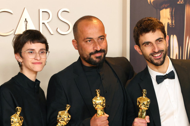 Hamdan Ballal (in the middle) in the Oscars photo room at the 97th Academy Awards in Hollywood, Los Angeles, California, U.S., March 2, 2025. REUTERS/Daniel Cole