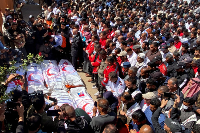 Palestinians mourn medics, who came under Israeli fire, after their bodies were recovered, according to the Red Crescent, at Nasser hospital in Khan Younis in the southern Gaza Strip March 31, 2025. REUTERS/Hatem Khaled