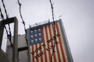 An anti-U.S. mural appears on a wall of a governmental building in downtown Tehran, Iran, on April 12, 2025, during the day of the Iran-U.S. nuclear discussions. According to Iranian officials, indirect nuclear discussions between Iran and the United States begin in Muscat, Oman, on April 12. (Photo by Morteza Nikoubazl/NurPhoto via Reuters Connect)