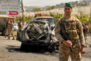 Lebanese soldiers secure the area where a SUV reportedly hit by an Israeli strike in Ghaziyeh, near the southern port city Sidon.
Reuters