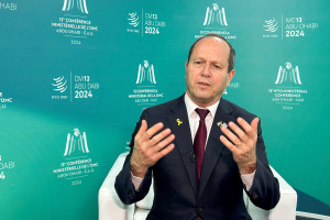 Israel’s Minister of Economy and Industry Nir Barkat gestures during an interview with Reuters at he 13th WTO ministerial conference, in Abu Dhabi, United Arab Emirates, February 26, 2024. REUTERS/Abdel Hadi Ramahi