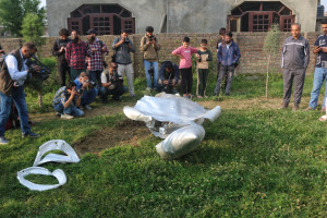 People look at a part of an unidentified aircraft in Wuyan near Kashmir's main city of Srinagar, Jammu and Kashmir, on May 7, 2025. (Photo by Firdous Nazir/NurPhoto via Reuters)