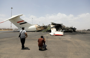 Members of the media take pictures of a destroyed plane at Sanaa International Airport, in the aftermath of an Israeli airstrike, in Sanaa, Yemen, May 7, 2025. REUTERS/Khaled Abdullah
