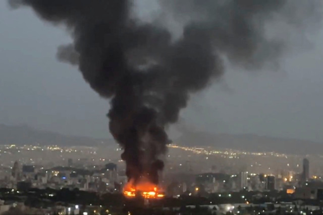 Smoke rises from a fire, as the Israel-Iran air war continues, in Tehran, Iran, in this still image obtained from social media video released June 17, 2025. Photo: Reuters Connect