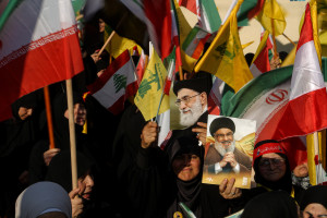June 25, 2025, Beirut, Beirut, Lebanon: Pro-Iranian Hezbollah supporters raise pictures of Iranian supreme leader Ayatollah Ali Khamenei and assassinated party leader Hassan Nasrallah during a rally near the Iranian embassy in Beirut to celebrate what they say Iran's victory, after U.S. President Donald Trump announced a ceasefire between Israel and Iran. (Credit Image: © Marwan Naamani/ Reuters