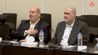 Senior Hamas official Khalil Al-Hayya gestures as he attends a meeting with Egyptian, Qatari and Turkish delegations ahead of a Gaza ceasefire deal announcement, in Sharm El-Sheikh, Egypt, October 8, 2025, in this still image obtained from a video. Al-Qahera News/Handout via REUTERS