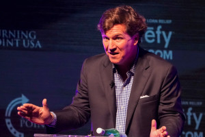 Former Fox News host Tucker Carlson speaks Tuesday, Oct. 21, 2025, during a Turning Point USA tour stop at the Indiana University Auditorium in Bloomington. Photo: Reuters Connect