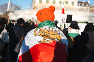 A supporter of the uprising in Iran carries a flag with the lion, the ancient flag of Iran and Persia. January 4, 2025 Photo: Vincent Koebel via Reuters Connect