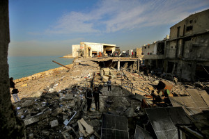 People inspect damage caused by an overnight Israeli air raid in the industrial area of Ghazieh on the outskirts of the southern Lebanese port city of Sidon. Israeli military launched strikes on southern and eastern parts Lebanon after warning it would hit what it called pro-Iranian Hezbollah and Palestinian Hamas targets, January 6, 2026 Photo: Marwan Naamani/ZUMA Press Wire via Reuters Connect