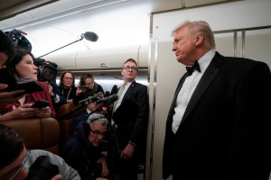 U.S. President Donald Trump speaks with members of the media on board Air Force One en route to Palm Beach, Florida, U.S., January 31, 2026. Photo: Reuters Connect by Nathan Howard