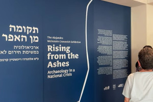 Introductory panel of the Israel Antiquities Authority exhibition “Rising from the Ashes,” hosted at the Alejandro Weinstein Crenovich Center near the Israel Museum in Jerusalem. (All Israel News)