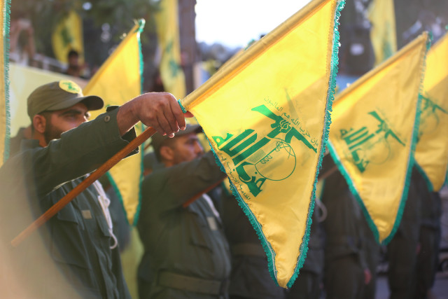 Military salute with Hezbollah flags in southern Lebanon (Photo: Shutterstock)