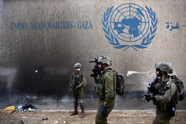 Israeli soldiers operate next to the UNRWA headquarters, amid the ongoing conflict between Israel and the Palestinian Islamist group Hamas, in the Gaza Strip, February 8, 2024. REUTERS/Dylan Martinez