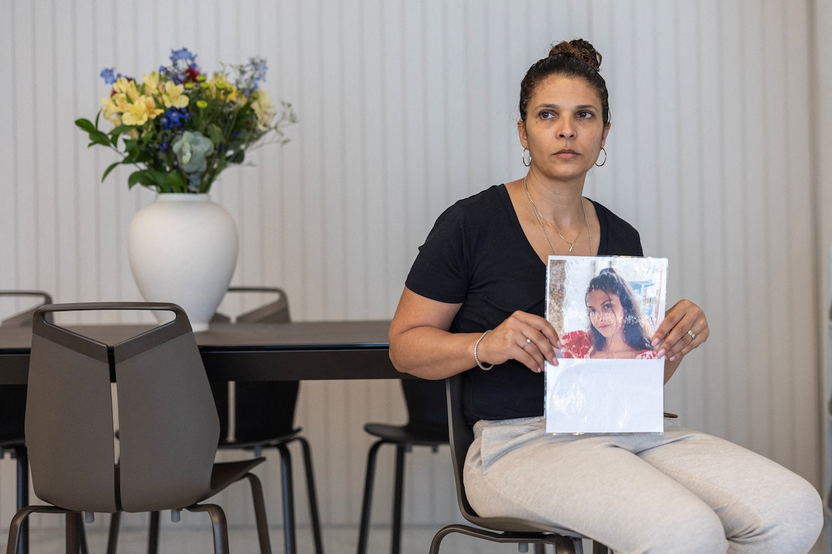 Orly Gilboa, the mother of hostage Daniela Gilboa, who was taken captive with other female Israeli soldiers during the deadly October 7 attack by Palestinian Islamist group Hamas, holds a picture of Daniela during an interview with Reuters in her home in Petah Tikva, Israel, May 22, 2024 (Photo: REUTERS/Marko Djurica).