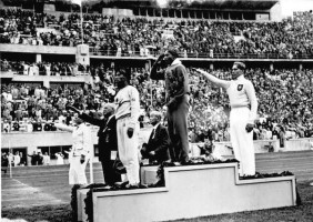 American Jesse Owens standing on the winners' podium after receiving the gold medal at the 1936 Olympics in Berlin, Germany (Photo: German Federal Archives via Wikimedia Commons)