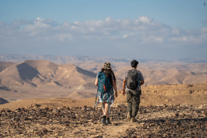 Travelers hike in Har Karkom, in the southwest Negev desert, on December 21, 2022. Photo by Yaniv Nadav/Flash90