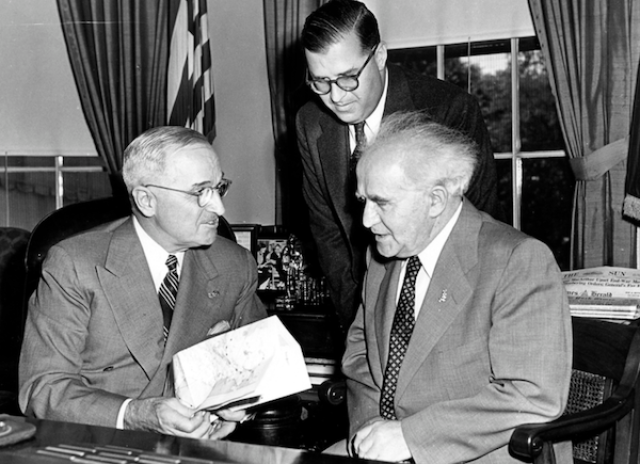 President Harry S. Truman accepting a gift from Prime Minister David Ben-Gurion (seated) and Ambassador H.E. Abba Eban of Israel. (photo credit: Truman Presidential Library)