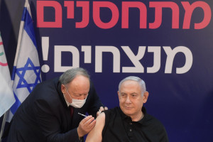 Prime Minister Benjamin Netanyahu gets vaccinated for COVID-19. (Photo: Amos Ben-Gershom/GPO)