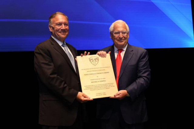 Former U.S. Ambassador to Israel David Friedman presents an award to former U.S. Secretary of State Mike Pompeo at the gala opening of The Friedman Center, Oct. 11, 2021. (Photo: Friedman Center Twitter feed, photographer Shauli Landner)