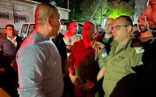 The family of Tiran Fero, an Israeli teenager whose body was snatched from a West Bank hospital by Palestinian gunmen, meets with security officials as his body is returned to Israel, November 23, 2022. (COGAT spokesperson's office)