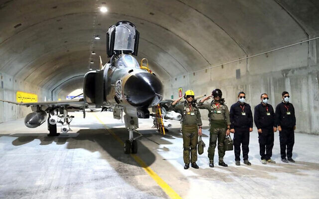 Pilots pose with an aircraft at a new underground Iranian air force base in this picture released February 7, 2023 (Iranian Army)