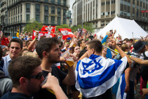 Israelis wear the Israeli flag in central Brussels on their way to the music festival Tomorrowland which took places in Boom, Belgium. July 23, 2015. Photo by Johanna Geron/FLASH90