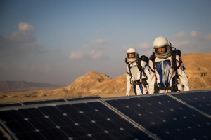 Israeli scientists walking near solar panels during a project simulates life in Mars, outside Mitzpe Ramon, Southern Israel, February 18, 2018, the D-MARS project is a a space analog research center in Israel, its founded by Israeli Space Agency and the Israeli Ministry of Science, Technology and Space. Photo by Yonatan Sindel/Flash90