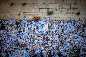 Jews hold Israeli flags as they dance at the Western Wall in Jerusalem's Old City, during Jerusalem Day celebrations, May 18, 2023. Photo by Yonatan Sindel/Flash90