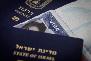 Illustration of passports and a travel visa. September 23, 2023. Photo by Chaim Goldberg/FLASH90