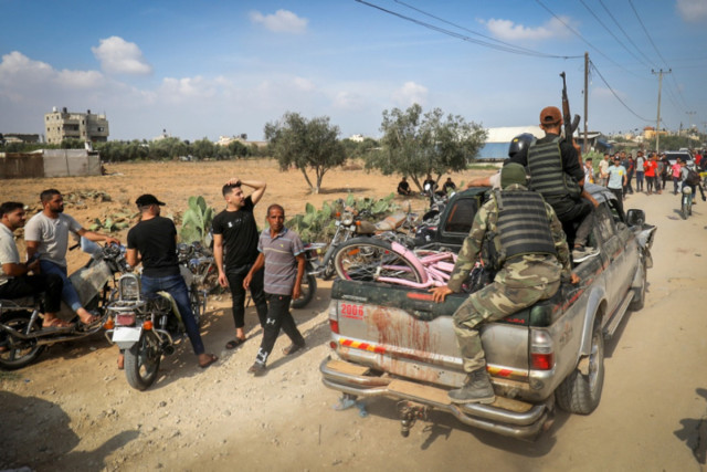 Palestinians near the border fence with Israel from Khan Yunis in the southern Gaza Strip, October 7, 2023 (Photo: Abed Rahim Khatib/Flash90).