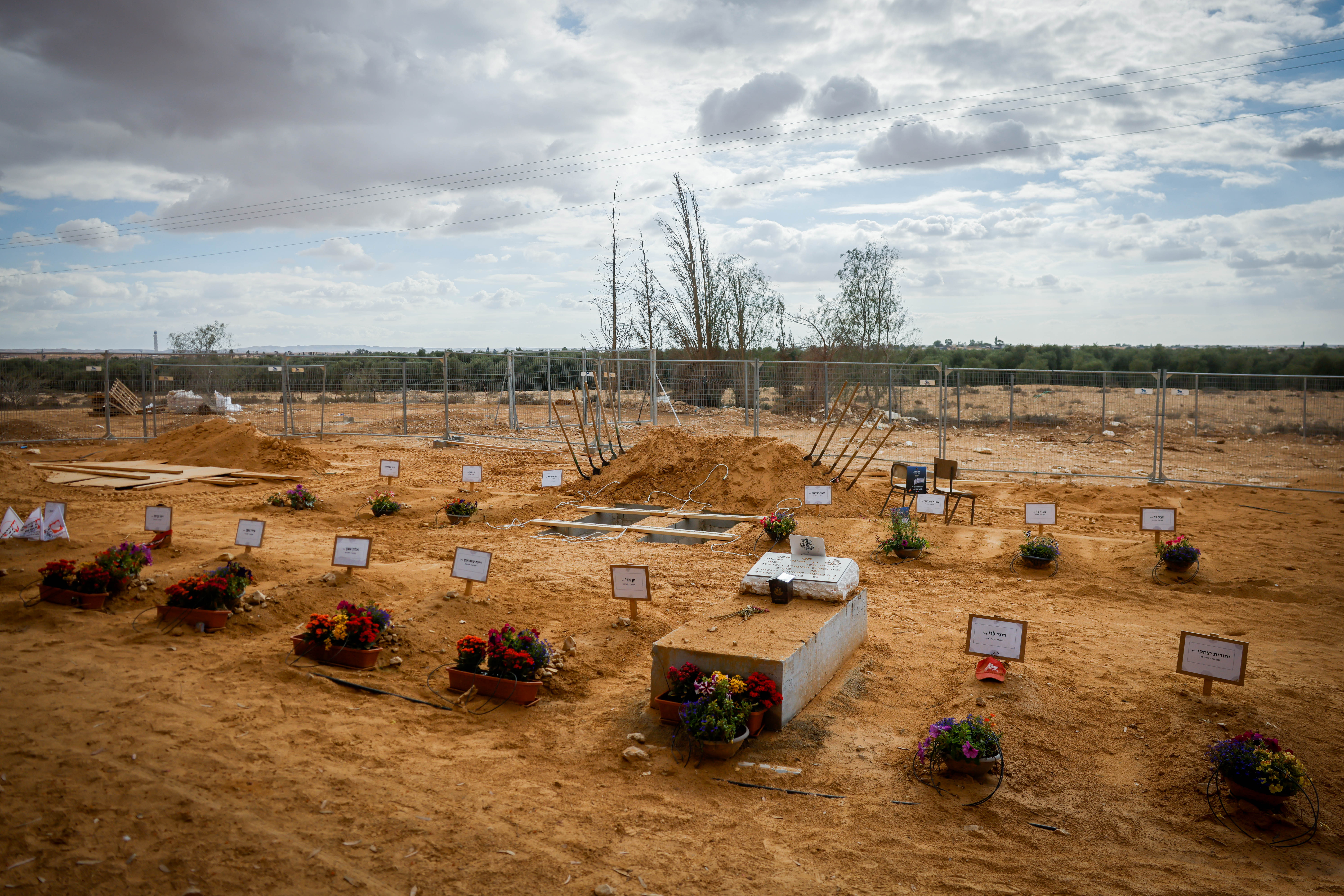 Graves of Kibbutz Be'eri residents who were murdered by Hamas terrorists on October 7, in Kibbutz Revivim, southern Israel, November 15, 2023. Photo by Chaim Goldberg/Flash90