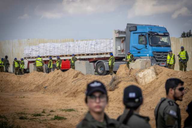 Israeli security forces guard while People protest against aid trucks entering the Gaza Strip, at the Kerem Shalom crossing in southern Israel, January 29, 2024. Photo by Chaim Goldberg/Flash90