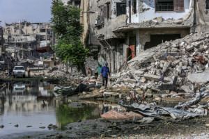 Palestinians amid the destruction caused by Israeli military operation in Khan Yunis, in the southern Gaza Strip, on July 1, 2024. Photo by Abed Rahim Khatib/Flash90